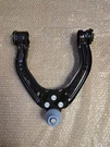 New Genuine 12-20 Tesla Model Front Upper Left Track Control Arm 6006532-00-B. Fixed Price $95.00.