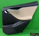 Tesla Model 2012-2016 Rear Door Trim Black/tan Right, Pass 1008105-09-L. Fixed Price $125.00.
